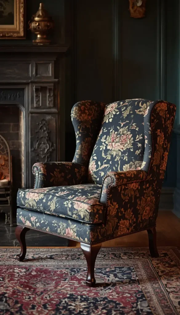 Vintage wingback armchair reupholstered in patterned dark blue and gold fabric placed in an interior living room.